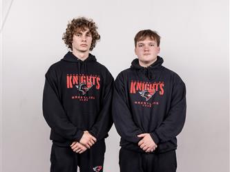 Two wrestling teammates posing
