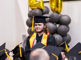 Students standing in audience for recognition