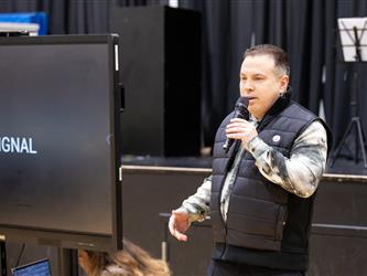 Staff speaking into microphone