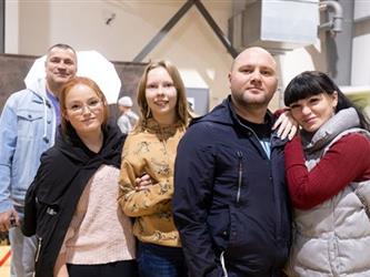 Group of people posing for camera