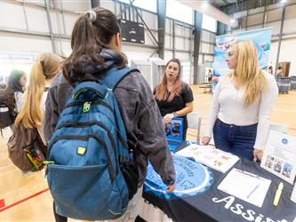 Students reviewing recruitment tables