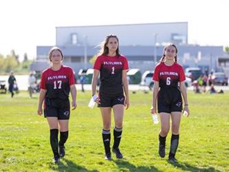 Three soccer players