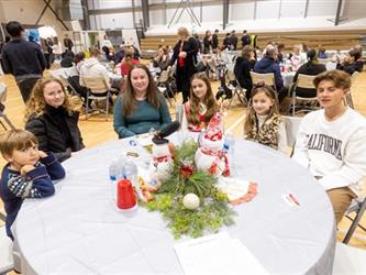 Family at table listening to performance